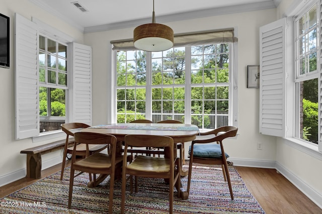 745 Royal Bonnet Dr, Wilmington, NC 28405 - dining space with baseboards, visible vents, ornamental molding, and a healthy amount of sunlight