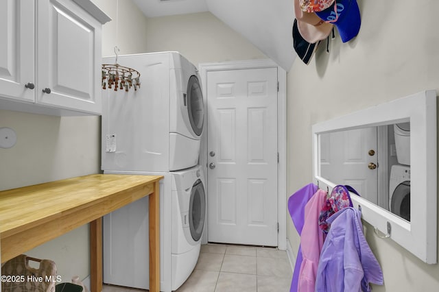 745 Royal Bonnet Dr, Wilmington, NC 28405 - laundry area featuring cabinet space, stacked washer and dryer, and light tile patterned floors