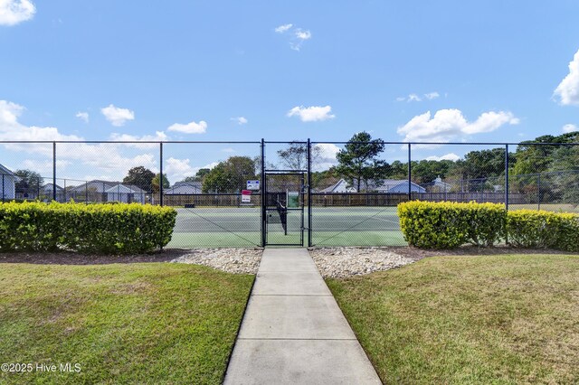 745 Royal Bonnet Dr, Wilmington, NC 28405 - view of sport court with a lawn, fence, and a gate