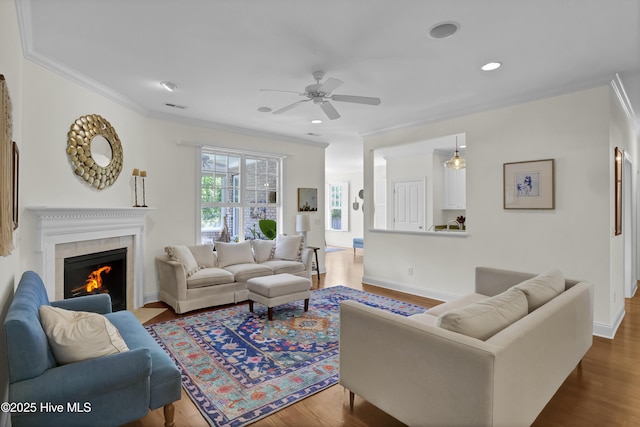 745 Royal Bonnet Dr, Wilmington, NC 28405 - living room with ornamental molding, a ceiling fan, dark wood finished floors, and a tile fireplace