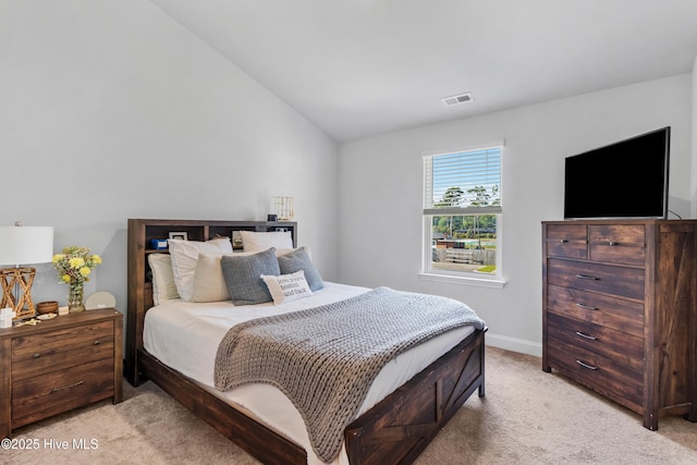 4739 Oyster Reef, Wilmington, NC 28405 - bedroom with baseboards, visible vents, vaulted ceiling, and light colored carpet