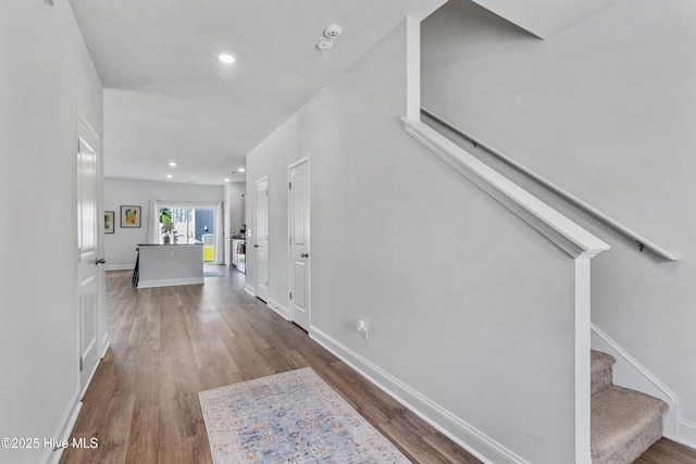 4739 Oyster Reef, Wilmington, NC 28405 - entrance foyer featuring baseboards, stairway, and dark wood-type flooring