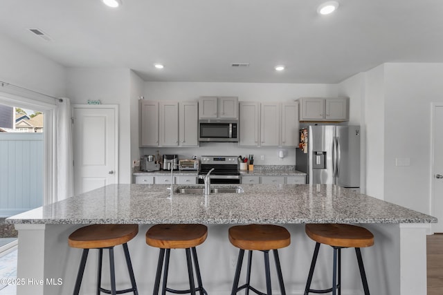 4739 Oyster Reef, Wilmington, NC 28405 - kitchen with gray cabinetry, appliances with stainless steel finishes, and visible vents