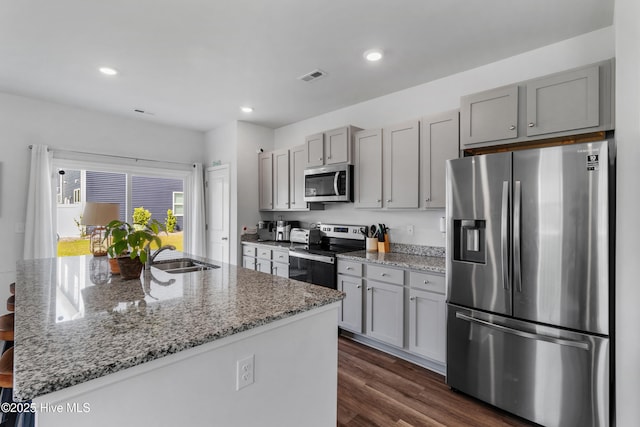 4739 Oyster Reef, Wilmington, NC 28405 - kitchen featuring stainless steel appliances, gray cabinetry, visible vents, and a sink