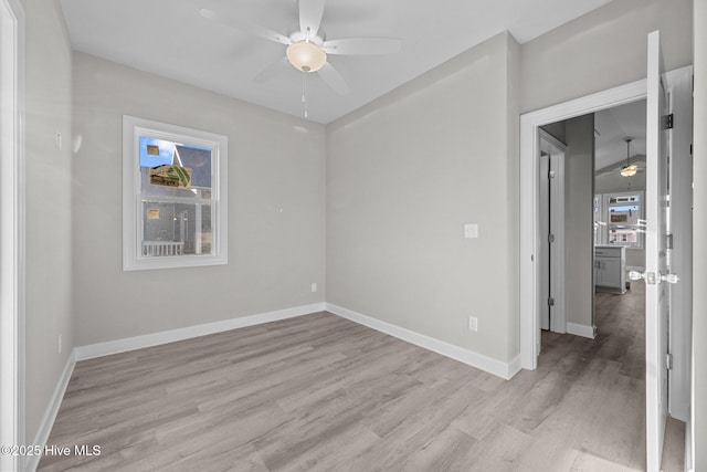 146 Sea Gull Ln, North Topsail Beach, NC 28460 - spare room featuring baseboards, a ceiling fan, and light wood-type flooring
