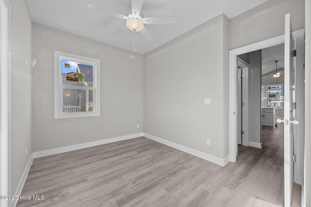 146 Sea Gull Ln, North Topsail Beach, NC 28460 - spare room featuring baseboards, a ceiling fan, and light wood-type flooring
