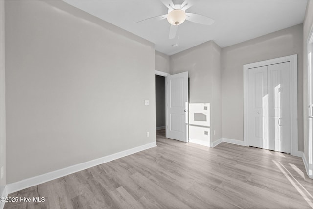 146 Sea Gull Ln, North Topsail Beach, NC 28460 - unfurnished bedroom with a ceiling fan, baseboards, and light wood-style floors