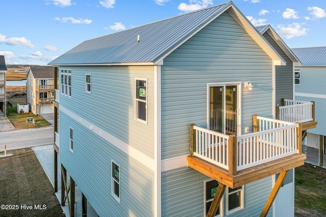 146 Sea Gull Ln, North Topsail Beach, NC 28460 - rear view of property featuring metal roof and a deck