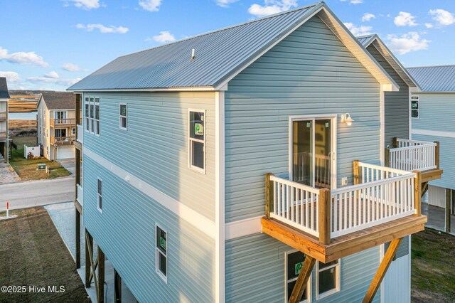 146 Sea Gull Ln, North Topsail Beach, NC 28460 - rear view of property featuring metal roof and a deck
