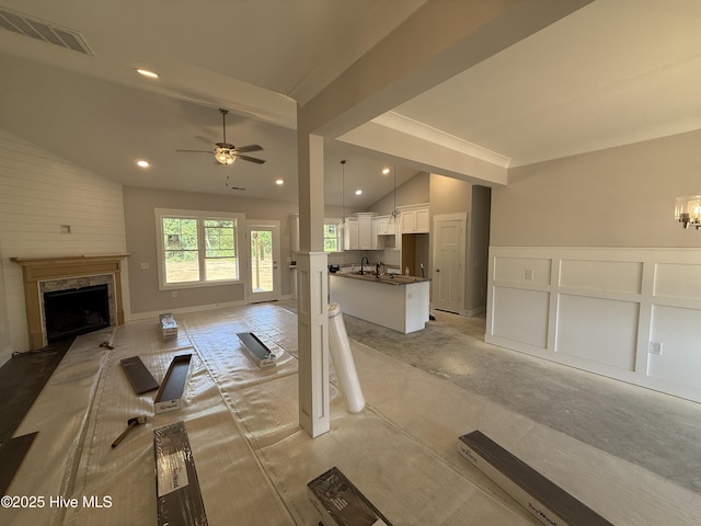 107 Tee Dr, Selma, NC 27576 - unfurnished living room featuring a ceiling fan, a fireplace, and recessed lighting