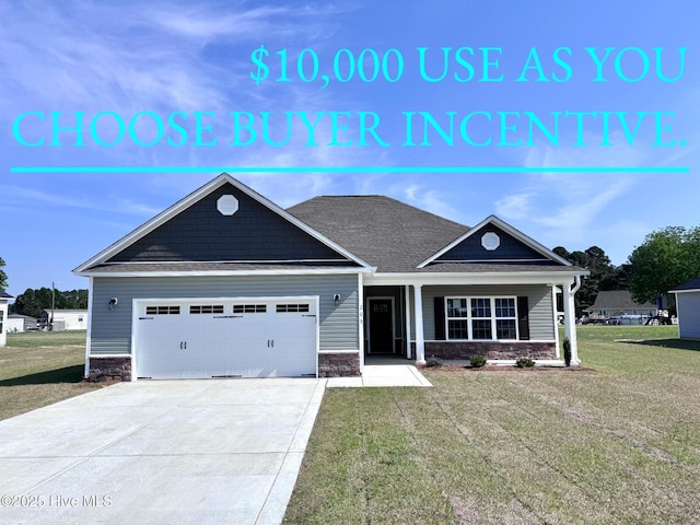 craftsman-style house with an attached garage, a front lawn, driveway, and stone siding