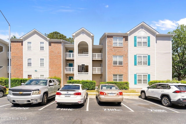 view of property featuring uncovered parking