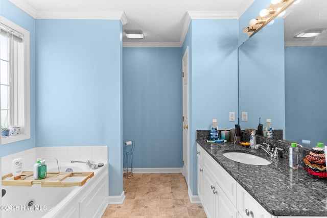 full bathroom featuring crown molding, vanity, a tub with jets, and a textured ceiling
