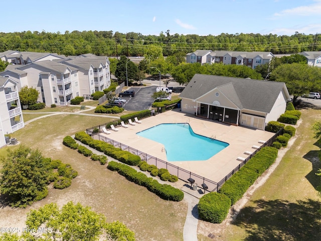pool with fence and a patio area
