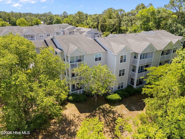 birds eye view of property with a residential view