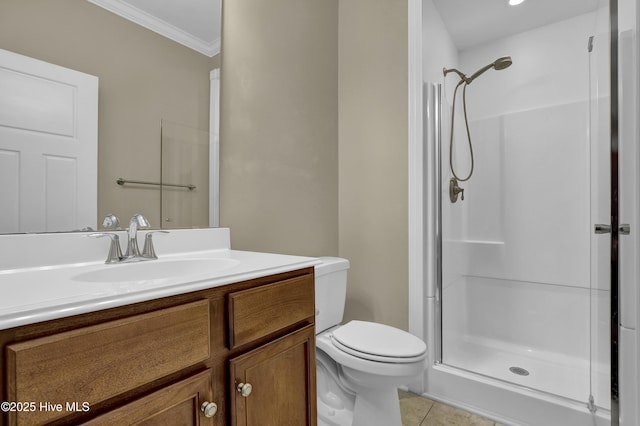 bathroom with tile patterned flooring, a shower stall, vanity, toilet, and ornamental molding
