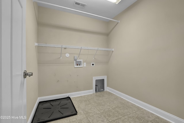 clothes washing area with laundry area, hookup for a washing machine, baseboards, hookup for an electric dryer, and visible vents