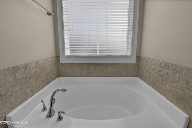 full bathroom with a bath
