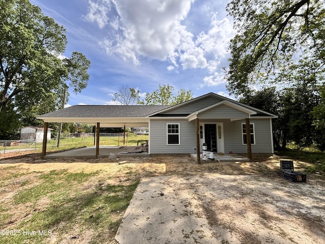 529 Fayetteville St, Clinton, NC 28328 - view of front of house with fence and a carport