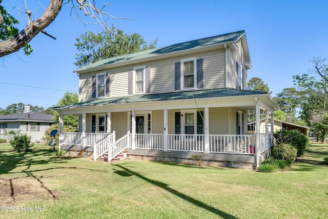 515 E Ridge St, Rose Hill, NC 28458 - country-style home with a porch and a front lawn