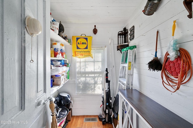 515 E Ridge St, Rose Hill, NC 28458 - laundry area featuring wood finished floors and wooden walls