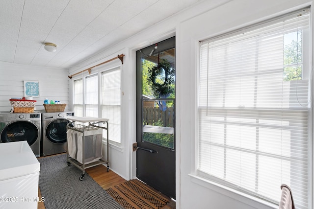 515 E Ridge St, Rose Hill, NC 28458 - laundry area with washer and clothes dryer and wood finished floors