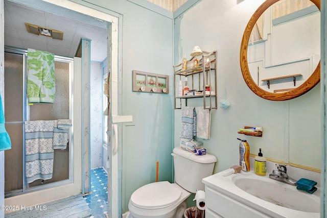 515 E Ridge St, Rose Hill, NC 28458 - full bathroom featuring a stall shower, vanity, and toilet