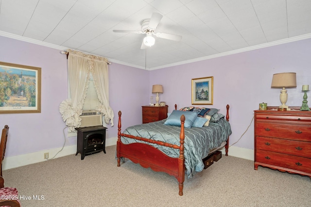 515 E Ridge St, Rose Hill, NC 28458 - bedroom featuring carpet floors, a ceiling fan, ornamental molding, a wood stove, and cooling unit