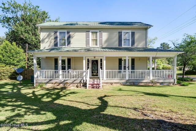 515 E Ridge St, Rose Hill, NC 28458 - country-style home with a porch, metal roof, and a front lawn