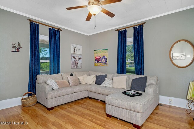 515 E Ridge St, Rose Hill, NC 28458 - living area with wood finished floors, a ceiling fan, and ornamental molding