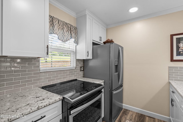 kitchen with decorative backsplash, white cabinetry, appliances with stainless steel finishes, and ornamental molding
