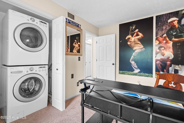 clothes washing area with laundry area, stacked washer and clothes dryer, carpet floors, visible vents, and baseboards
