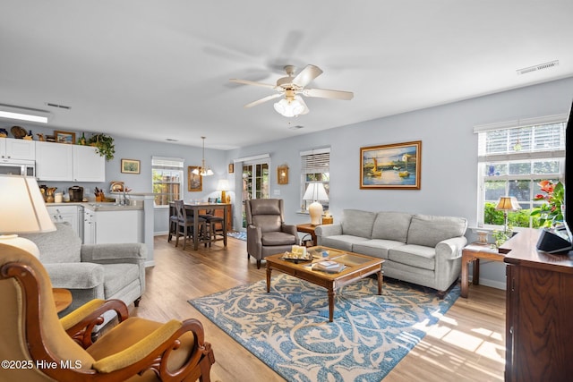 1164 Amber Pines Dr, Leland, NC 28451 - living room with visible vents, light wood-style flooring, and a ceiling fan