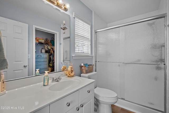 1164 Amber Pines Dr, Leland, NC 28451 - bathroom with vanity, toilet, wood finished floors, and a shower stall