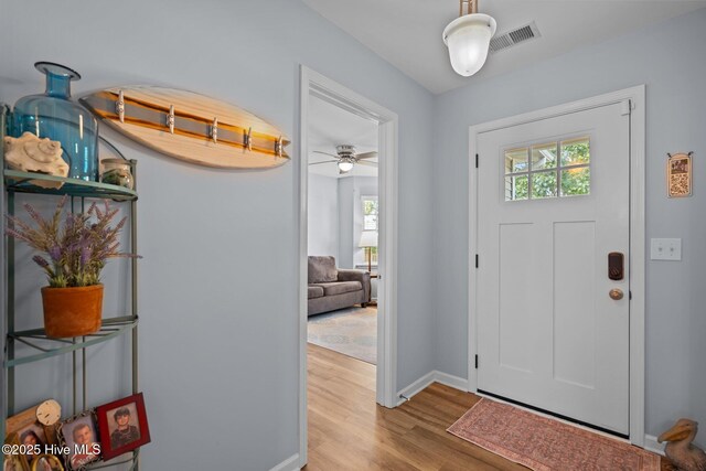 1164 Amber Pines Dr, Leland, NC 28451 - foyer with baseboards, a healthy amount of sunlight, visible vents, and wood finished floors