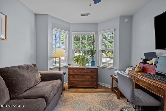1164 Amber Pines Dr, Leland, NC 28451 - home office with visible vents, wood finished floors, baseboards, and ceiling fan
