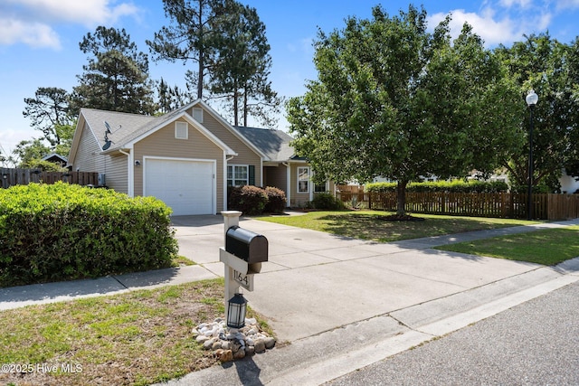 1164 Amber Pines Dr, Leland, NC 28451 - view of front of home with concrete driveway, a front yard, an attached garage, and fence