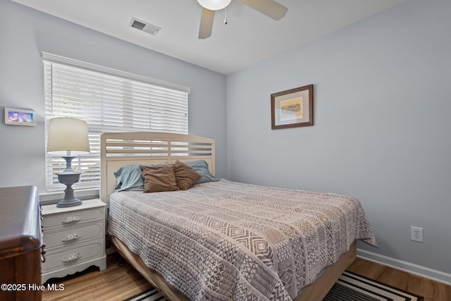 1164 Amber Pines Dr, Leland, NC 28451 - bedroom with baseboards, ceiling fan, visible vents, and wood finished floors
