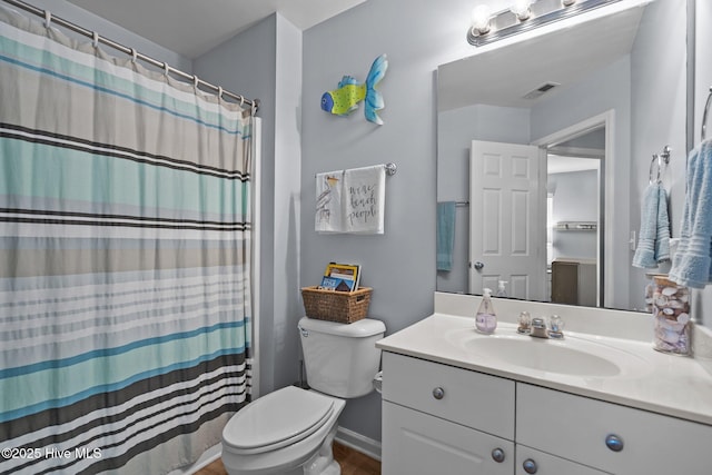 1164 Amber Pines Dr, Leland, NC 28451 - bathroom with toilet, visible vents, a shower with shower curtain, vanity, and wood finished floors