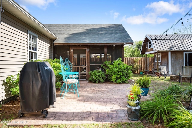 1164 Amber Pines Dr, Leland, NC 28451 - view of patio featuring fence, a grill, and an outdoor structure