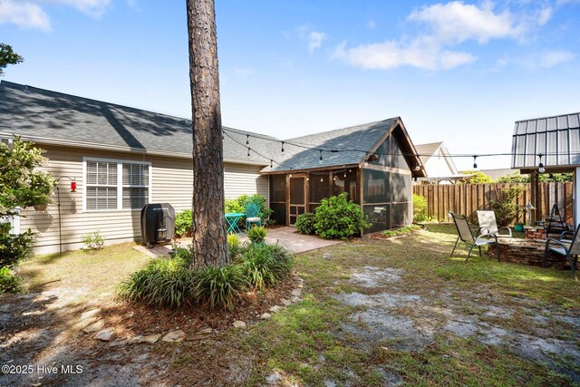 1164 Amber Pines Dr, Leland, NC 28451 - view of yard with a sunroom, a patio, and fence