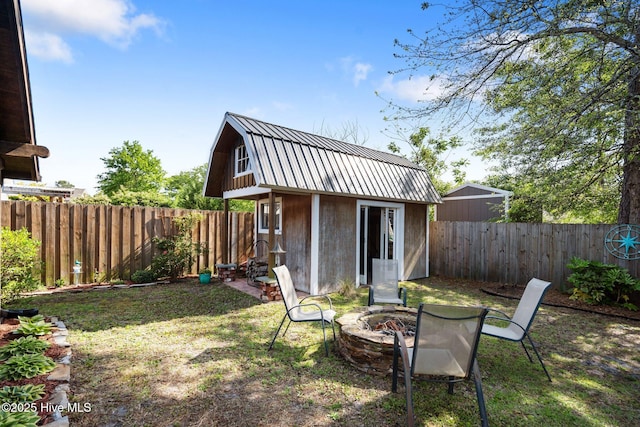 1164 Amber Pines Dr, Leland, NC 28451 - view of outbuilding with an outdoor fire pit, an outbuilding, and a fenced backyard
