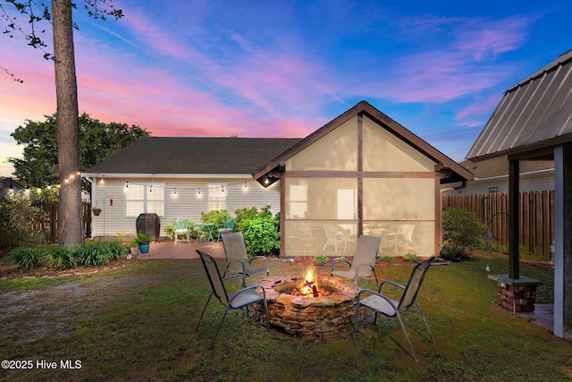 1164 Amber Pines Dr, Leland, NC 28451 - back of house with an outdoor fire pit, a yard, fence, and a patio