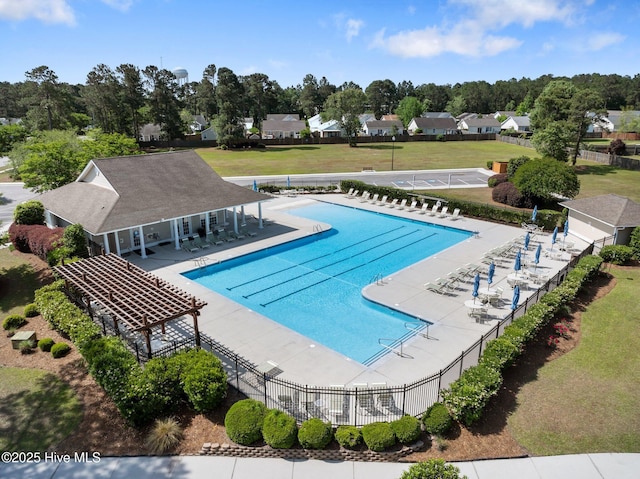 1164 Amber Pines Dr, Leland, NC 28451 - community pool with a patio area, fence, and a lawn