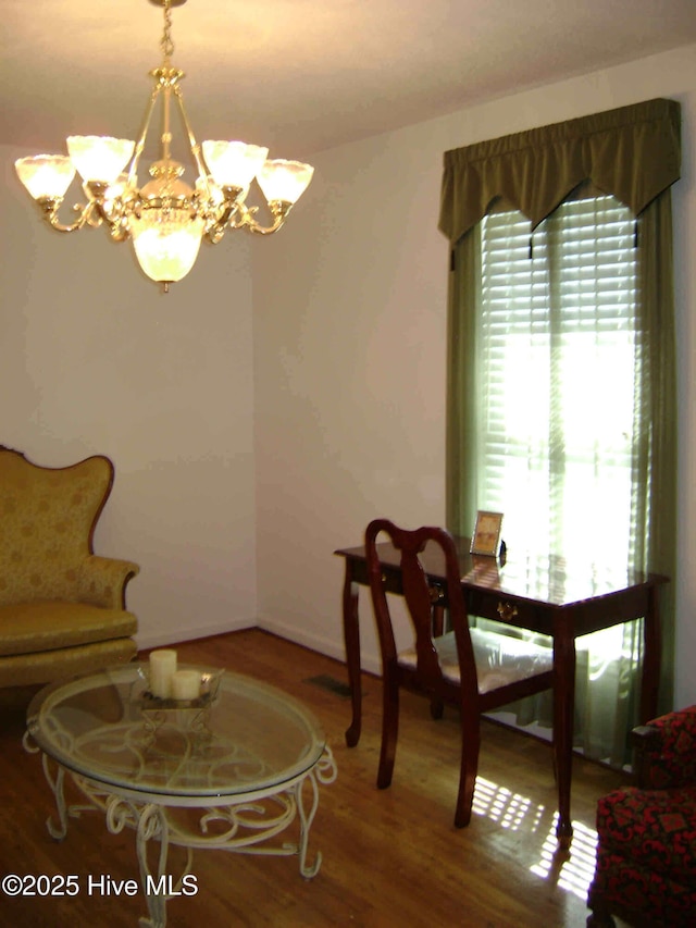 501 US-13, Windsor, NC 27983 - dining room featuring a notable chandelier and wood finished floors