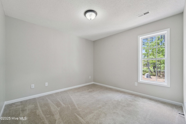 142 Burton Rd, Southport, NC 28461 - unfurnished room with carpet floors, a textured ceiling, visible vents, and baseboards