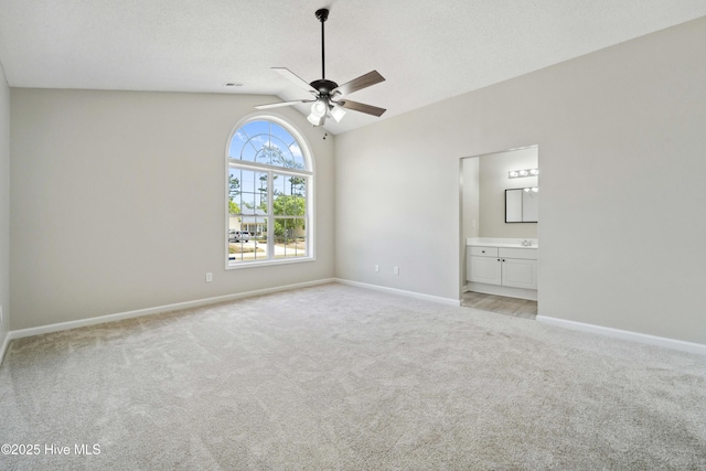 142 Burton Rd, Southport, NC 28461 - unfurnished bedroom featuring light colored carpet, baseboards, and lofted ceiling