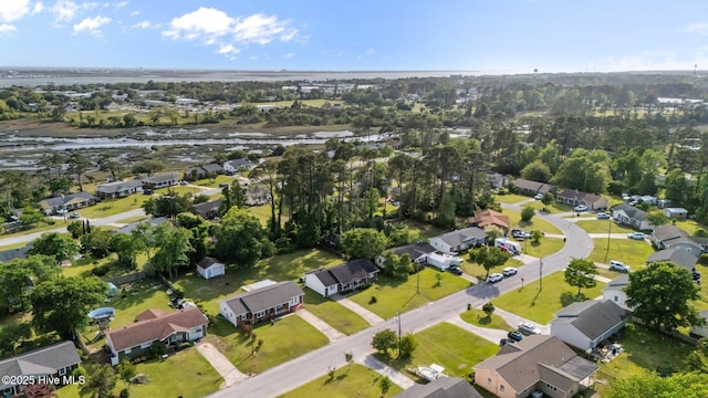 birds eye view of property with a water view and a residential view