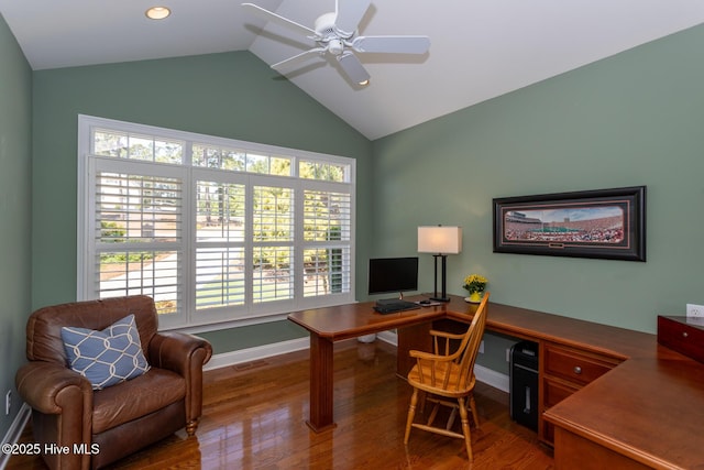 office featuring baseboards, a ceiling fan, wood finished floors, and high vaulted ceiling
