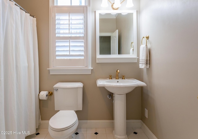 118 Dennis Cir W, End, NC 27376 - bathroom with baseboards, toilet, tile patterned flooring, and a shower with shower curtain